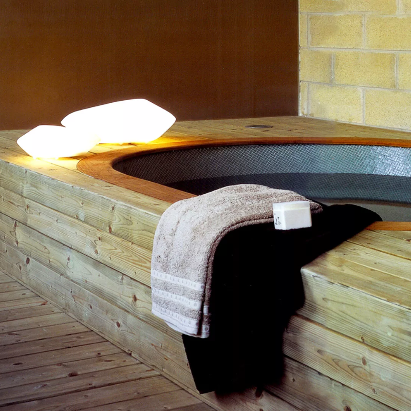 The Stones Outdoor Lamp from Oluce in a bathroom.