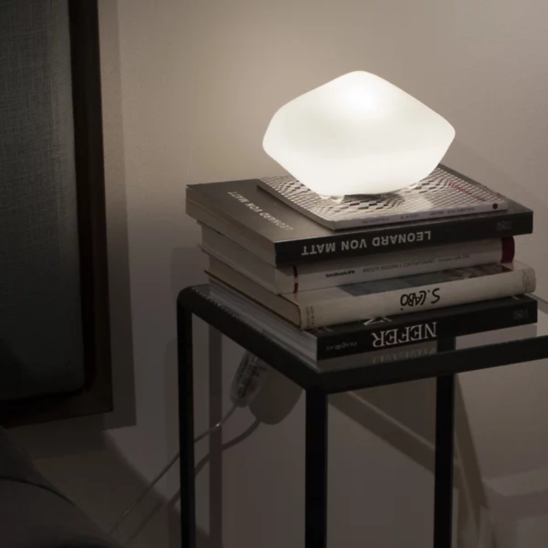 The Stones Outdoor Lamp from Oluce in a living room.