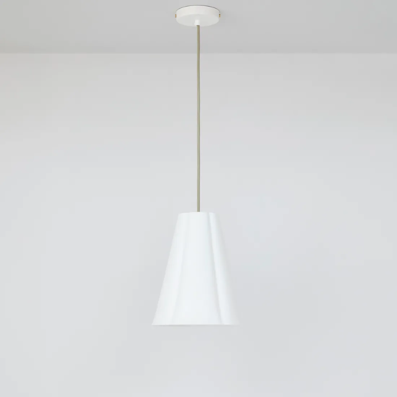 The medium Blossom Pendant from Original BTC with grey cable in a studio.