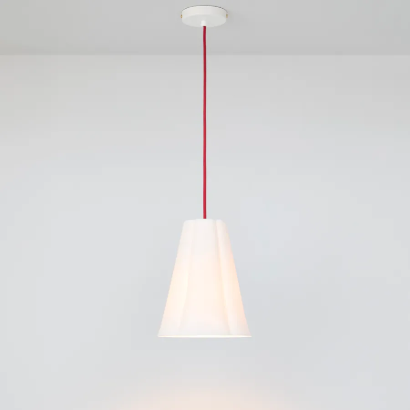 The medium Blossom Pendant from Original BTC with red cable turned on.