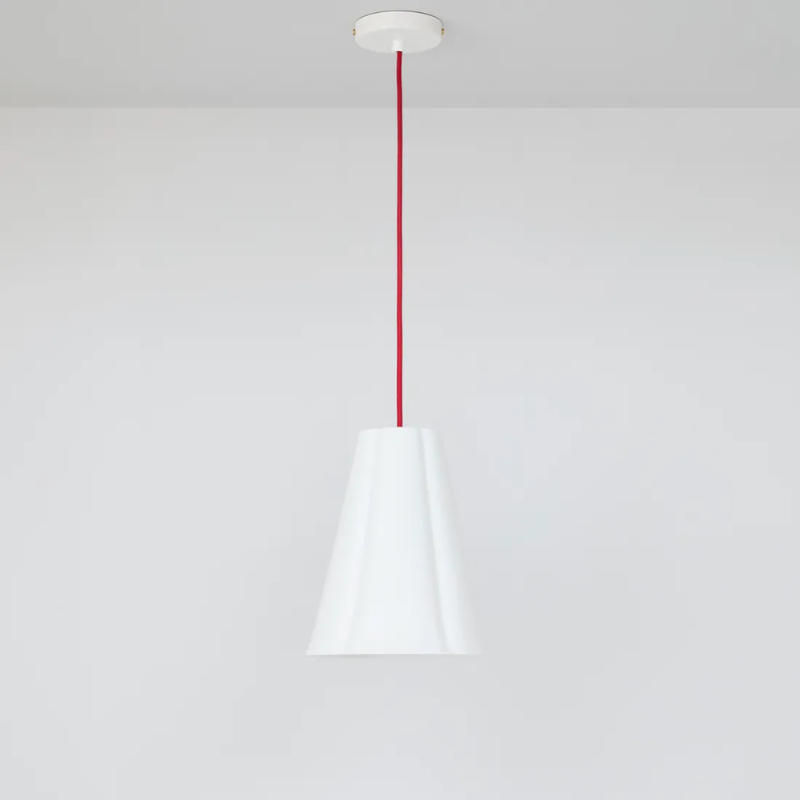 The medium Blossom Pendant from Original BTC with red cable.