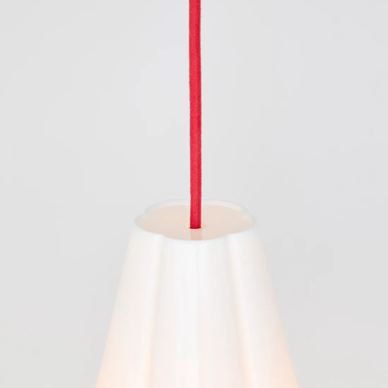 The Blossom Pendant from Original BTC with red cable in detail.