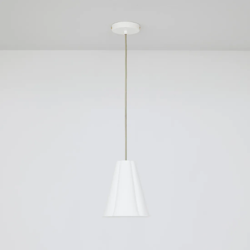 The small Blossom Pendant from Original BTC with grey cable in a studio.