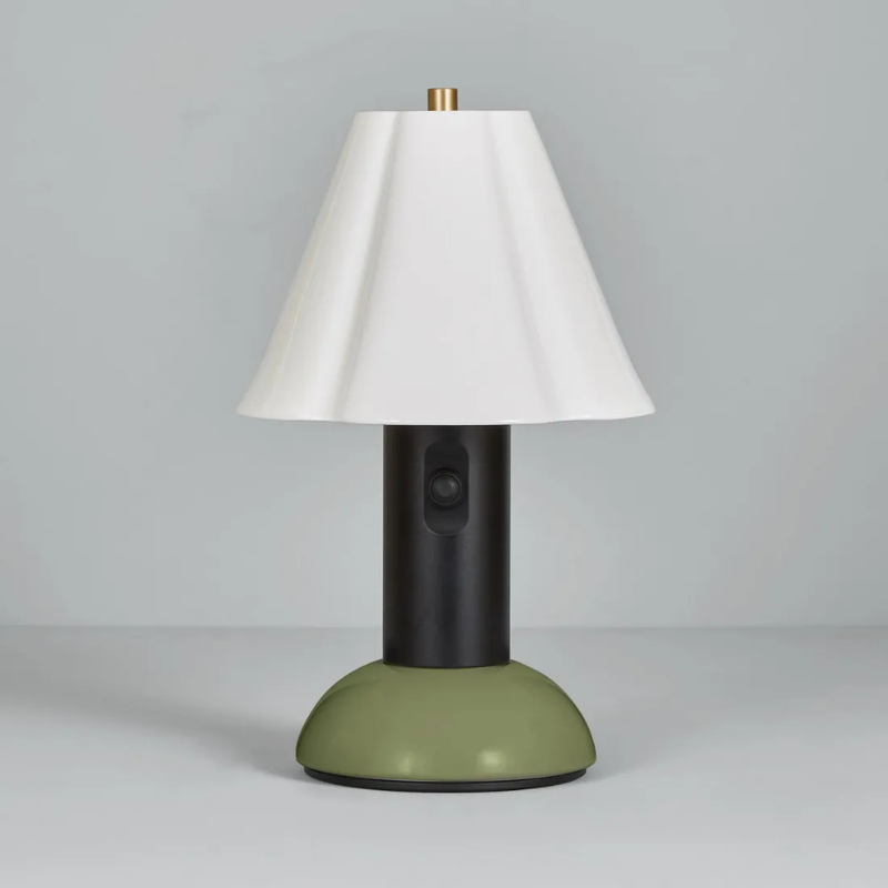 The Blossom Portable Light from Original BTC in olive green in a studio.