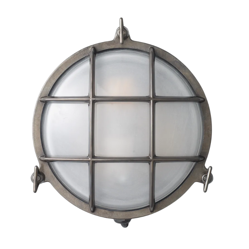 The medium Brass Bulkhead Outdoor Wall Sconce from Original BTC in weathered brass.