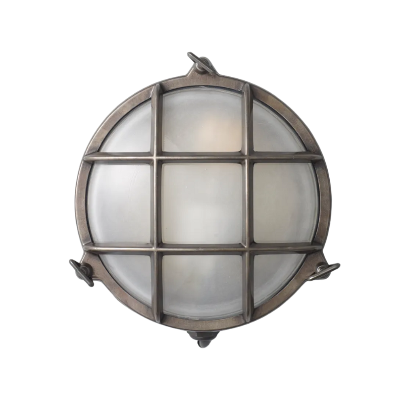 The small Brass Bulkhead Outdoor Wall Sconce from Original BTC in weathered brass.