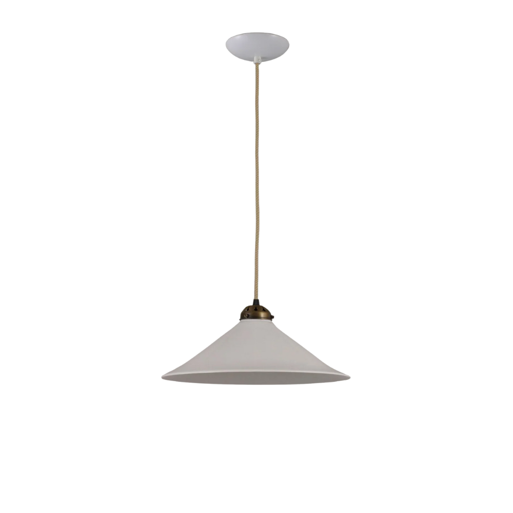 The large antique brass Cobb Pendant from Original BTC in a studio.