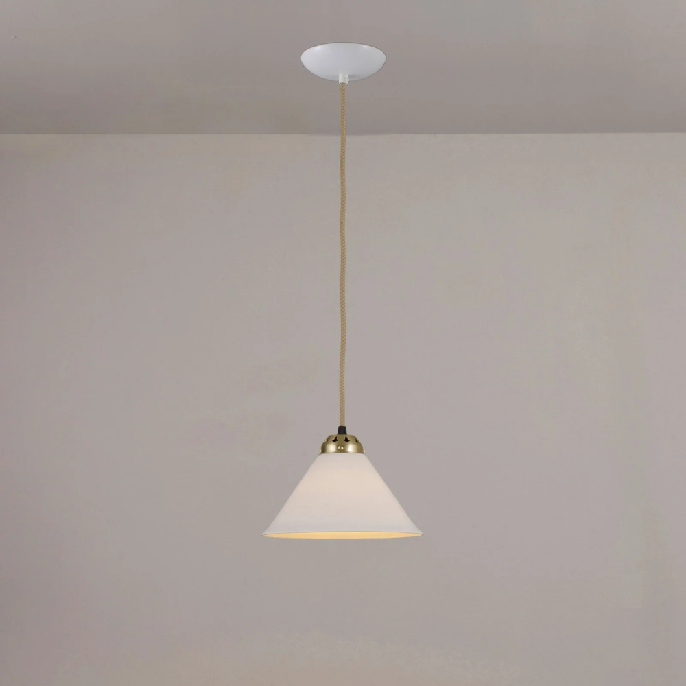 The small satin brass Cobb Pendant from Original BTC turned on.
