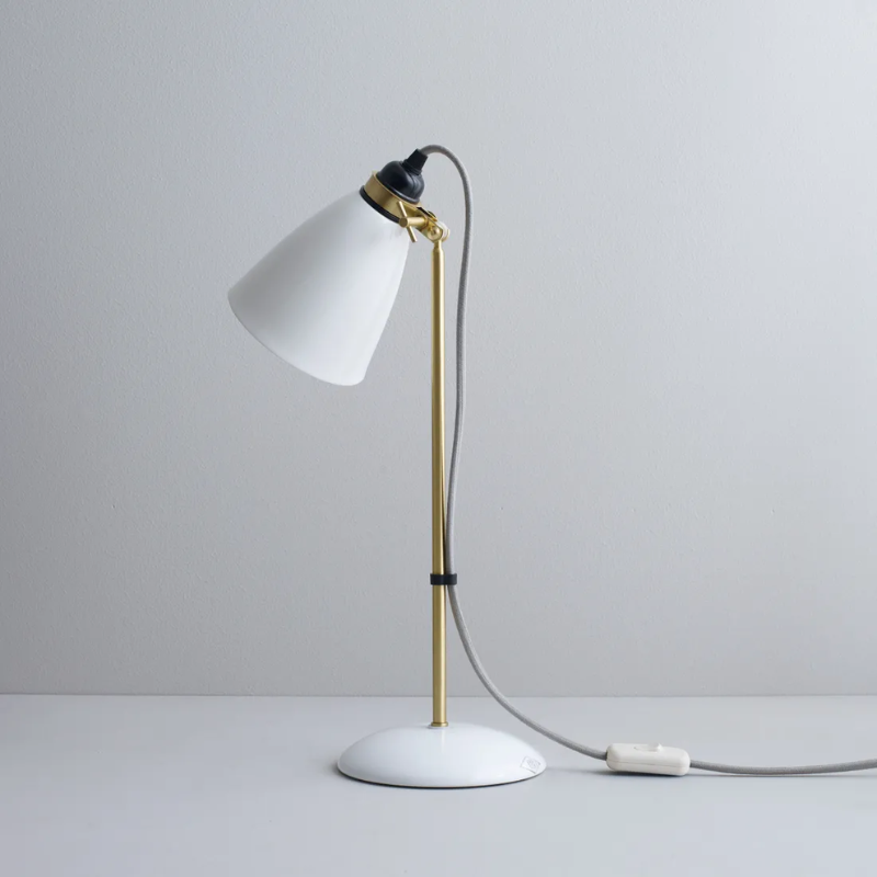 The Hector 30 Table Light from Original BTC with a grey cable in a studio from an angle.