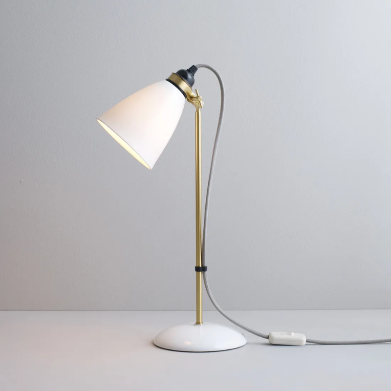 The Hector 30 Table Light from Original BTC with a grey cable in a studio turned on.