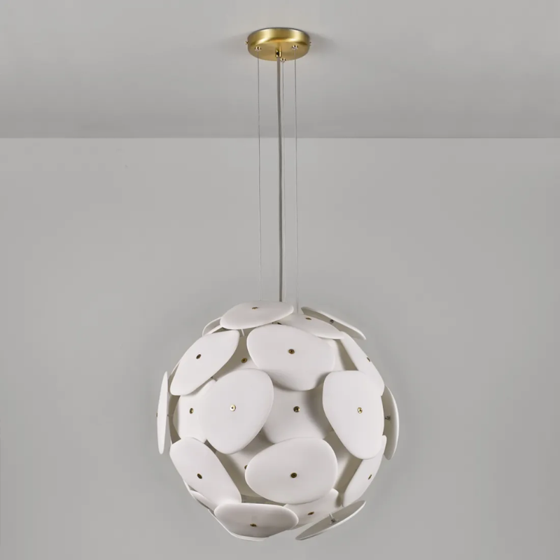 The Pebble Pendant from Original BTC in a lounge.