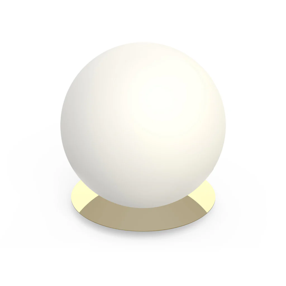 The 16 inch brass Bola Sphere Table from Pablo Designs.