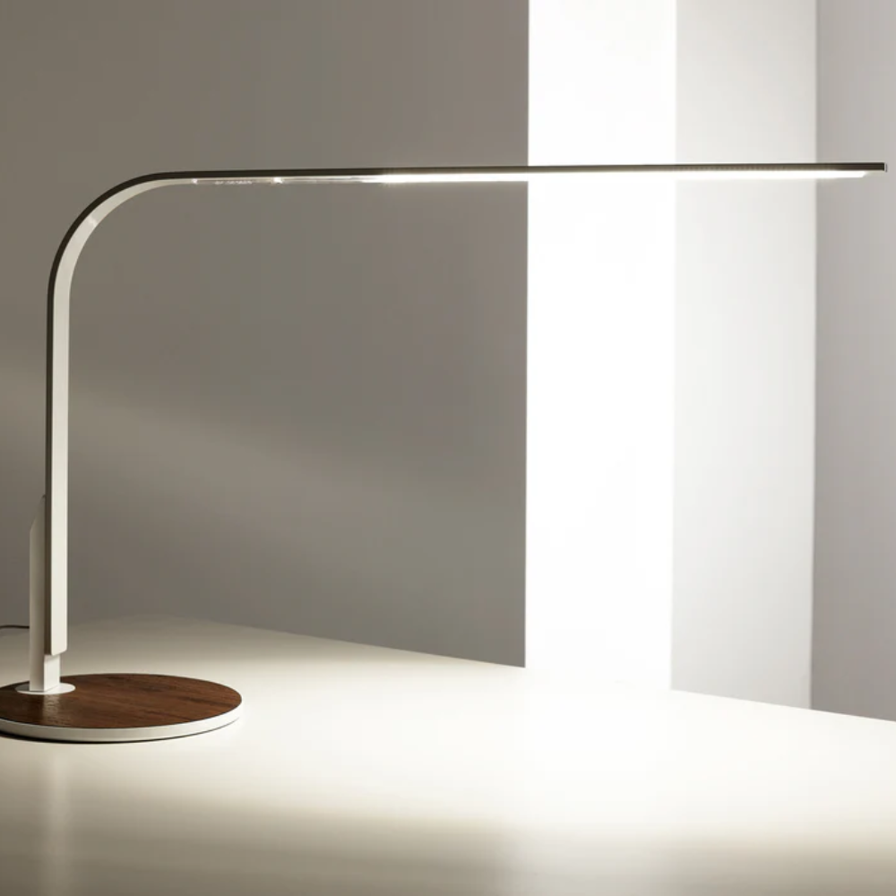 The LIM360 Table Lamp from Pablo Designs in a home office. all-groups