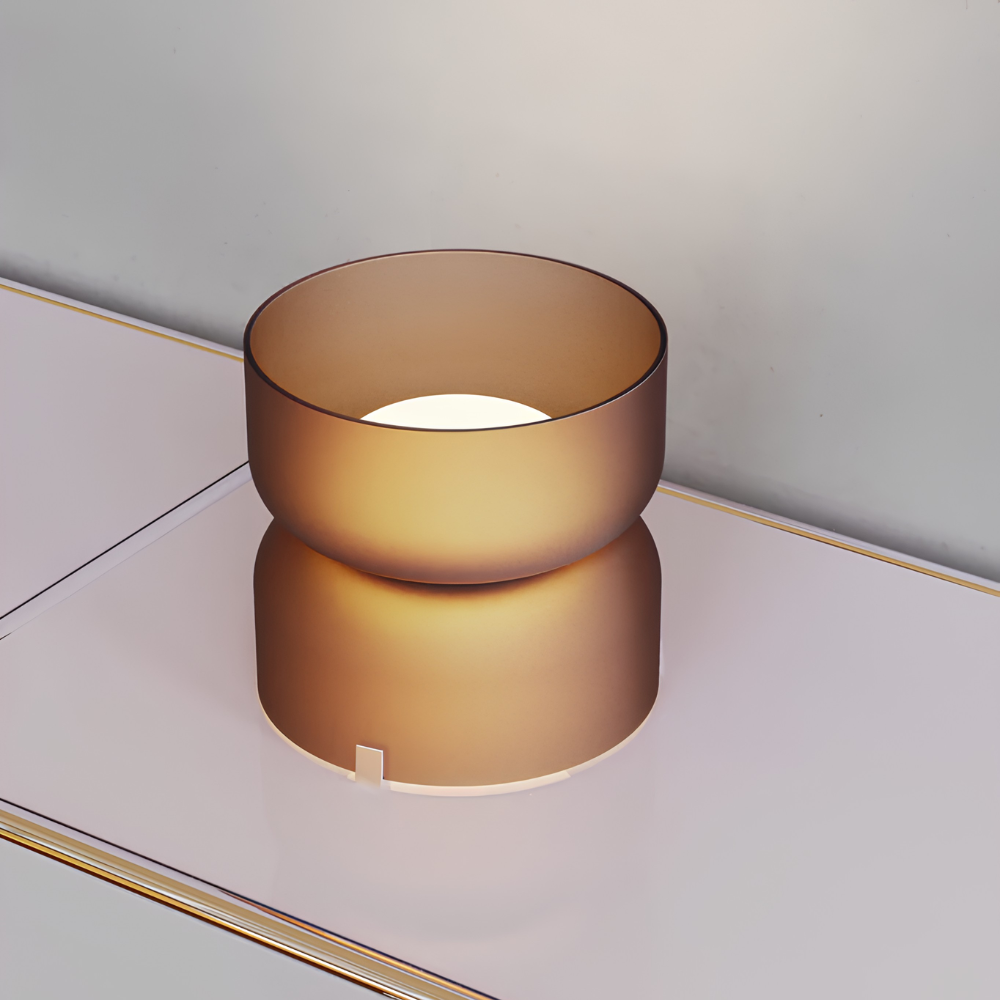 The etched amber Mini Totem Table Lamp from Pablo Designs in a family area.