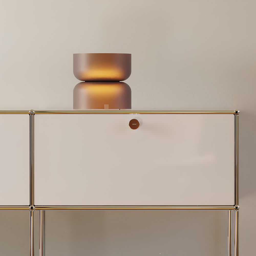 The etched amber Mini Totem Table Lamp from Pablo Designs in a lounge.