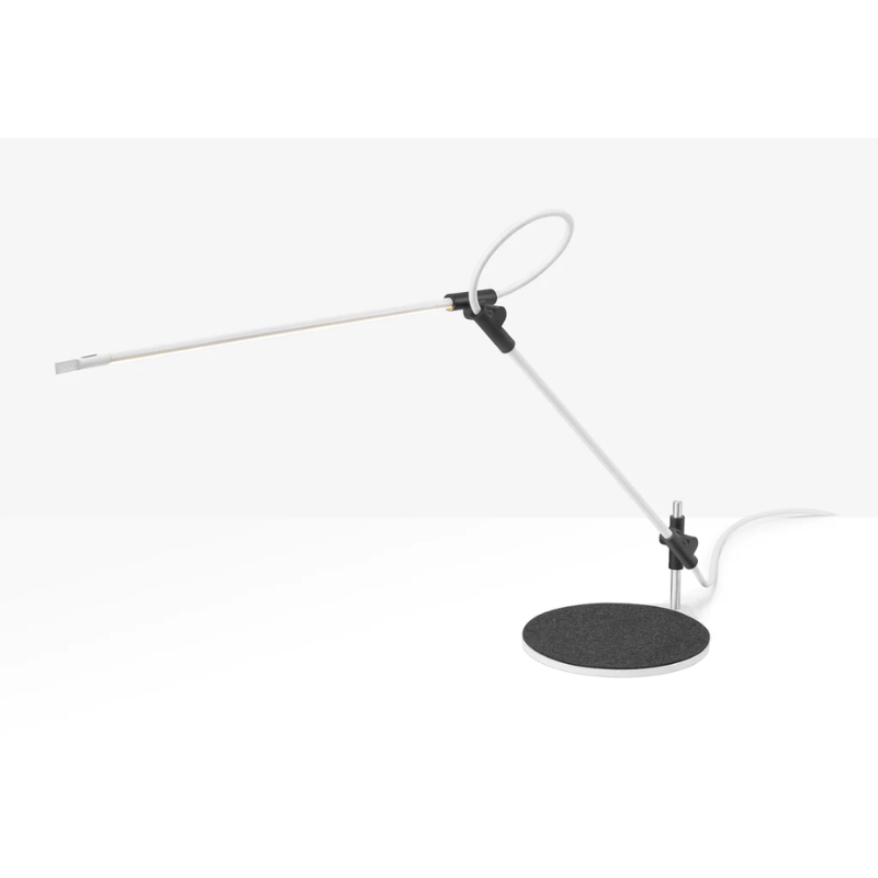 The white Superlight Table Lamp from Pablo Designs at an angle.