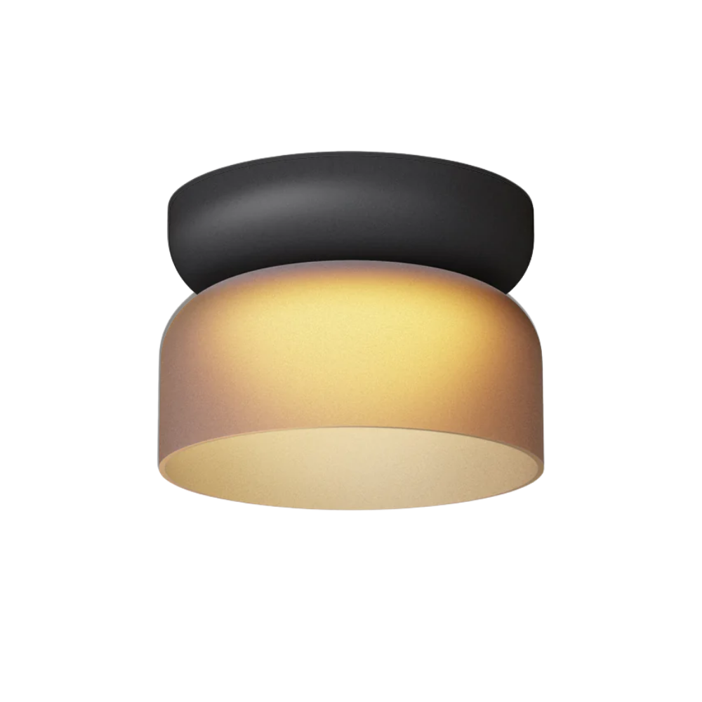 The Totem Mini Flush Mount by Pablo Designs with an etched amber shade and black base mount.