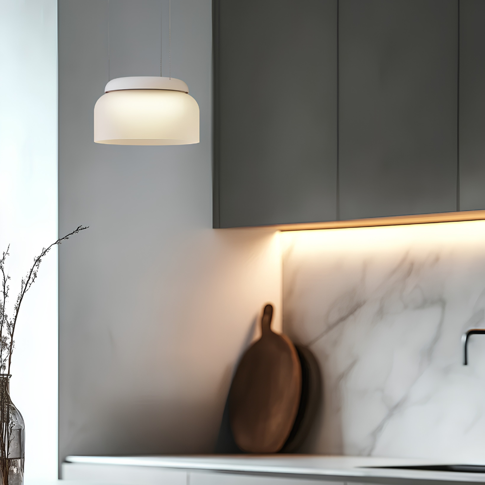 The Totem Mini Pendant from Pablo Designs in a living room. all-groups.