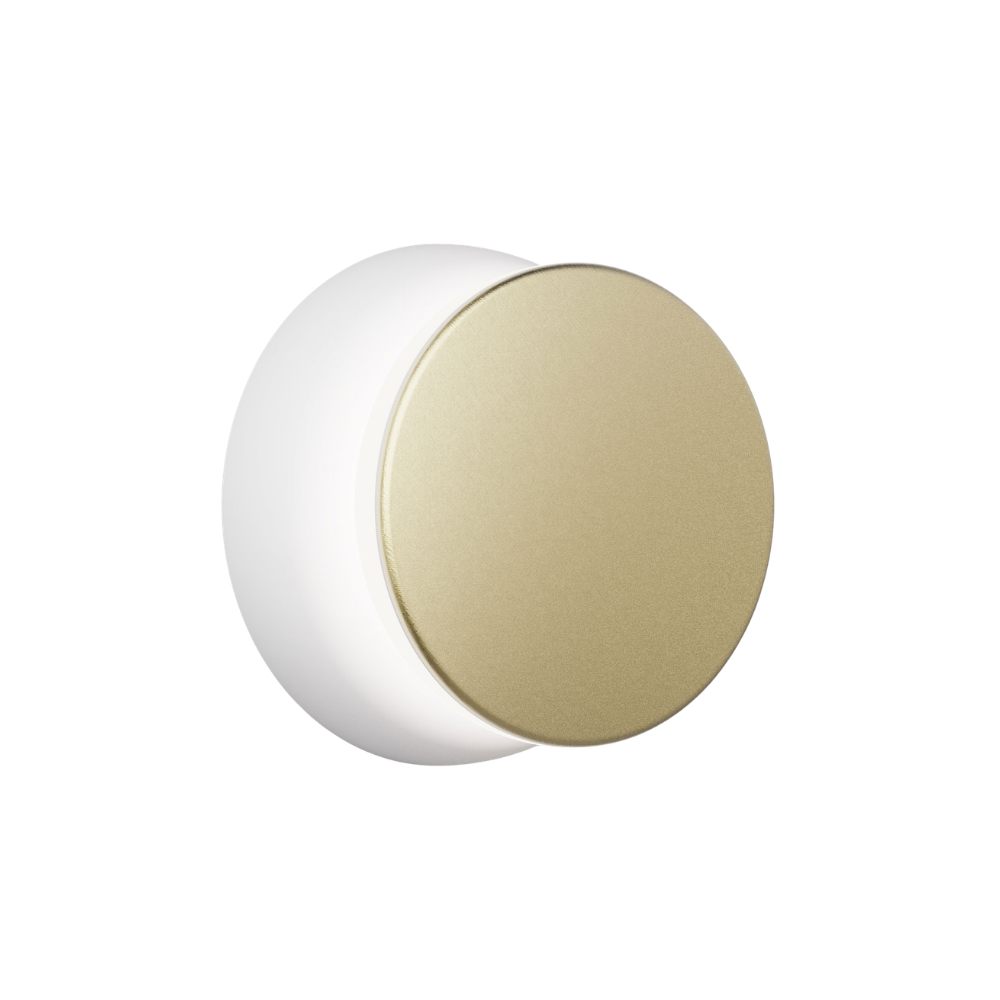 The white and brass Totem Puck Ceiling or Wall Light from Pablo Designs.