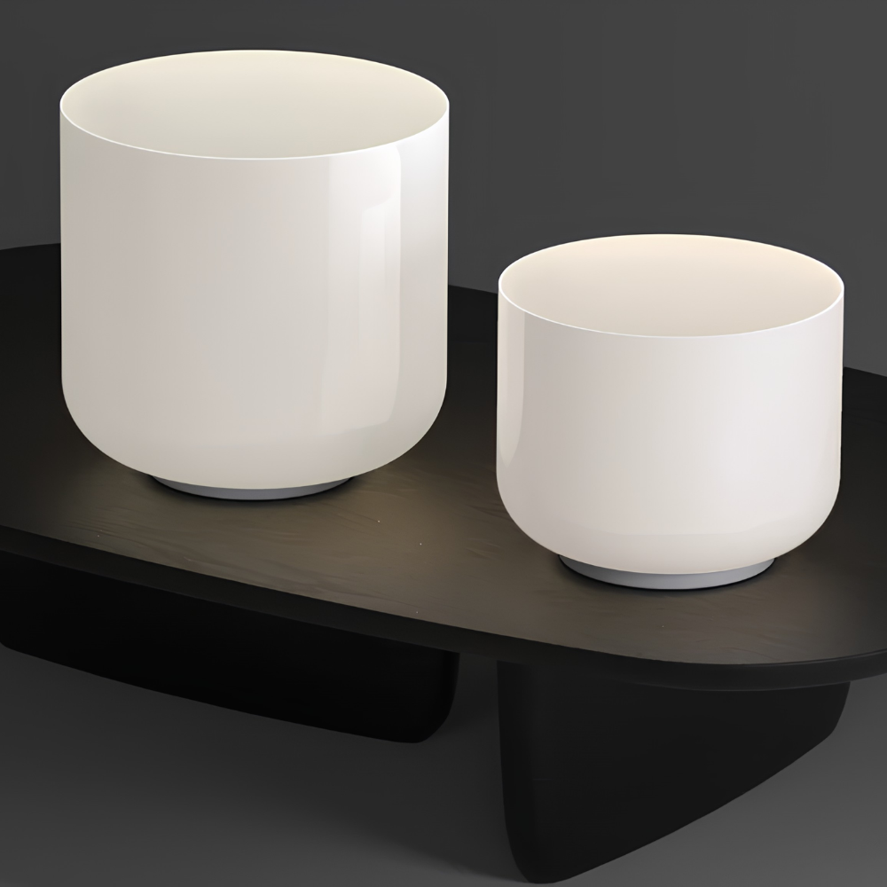 Both the Totem Single Table Lamp design A and B from Pablo Designs in a living space. all-groups