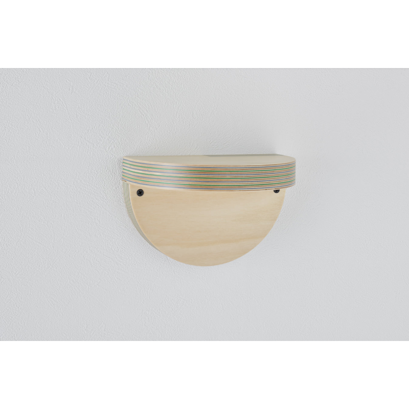 The large Cap Wall Shelf from Plywood Laboratory size large in blue green within a studio.