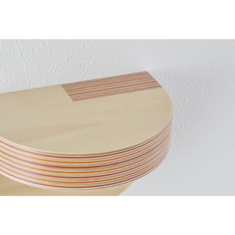 The small Cap Wall Shelf from Plywood Laboratory in red orange within a close up.