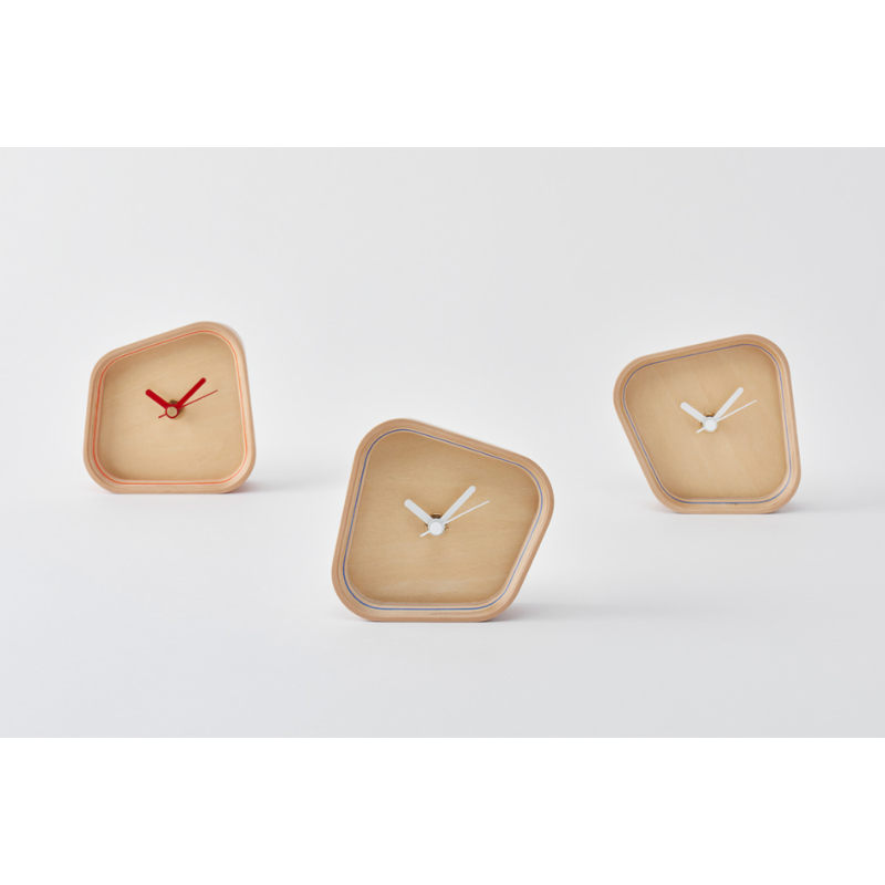 The color options for the Rotation Clock from Plywood Laboratory in a home office. all-groups
