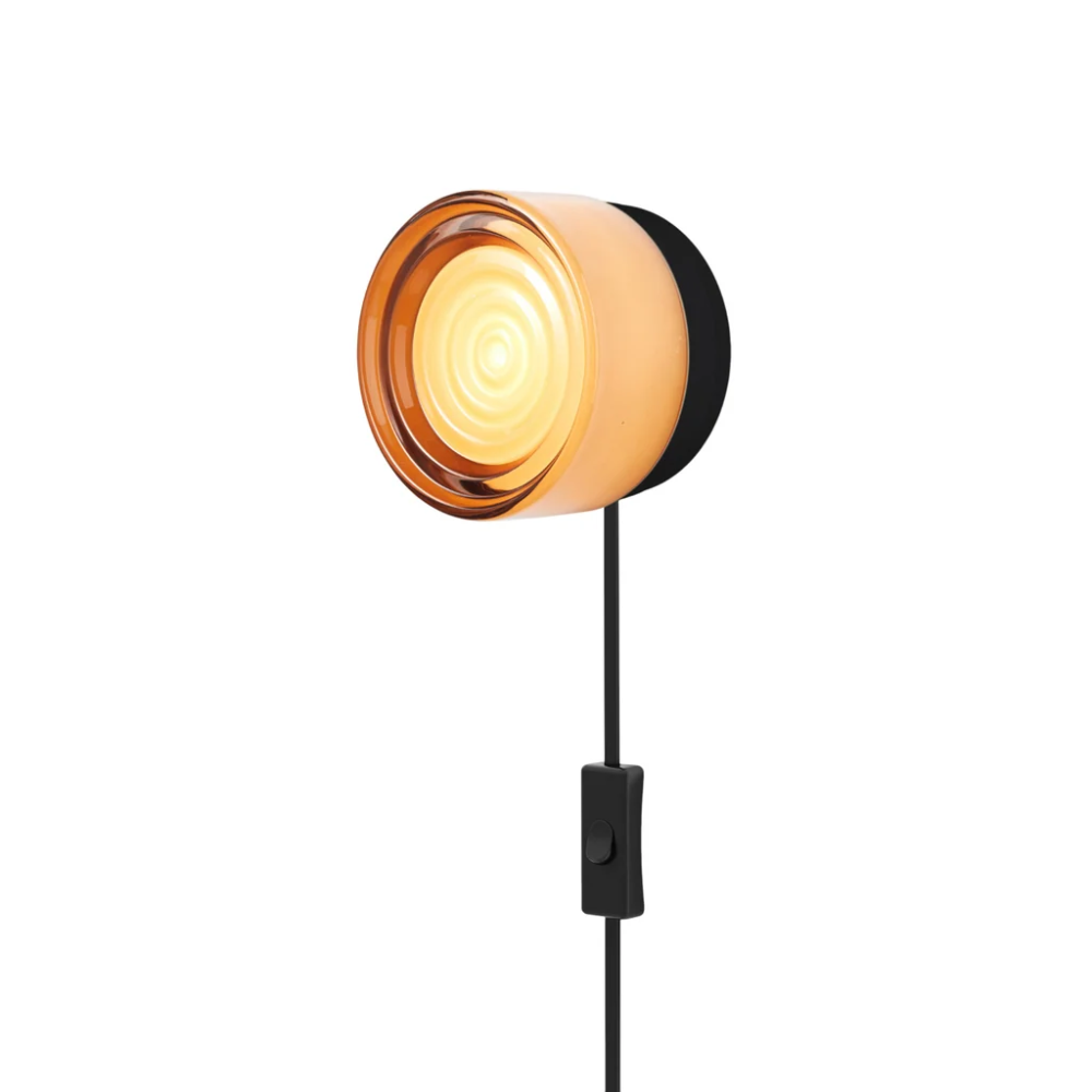 The Ripple Corded Sconce with plug-in bottom with toggle switch in copper exterior shade with black anodized.
