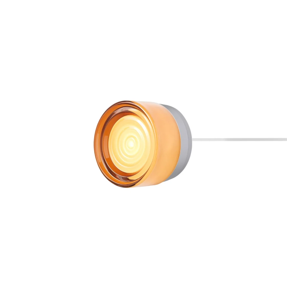 The Ripple Corded Sconce with plug-in back in copper exterior shade with natural anodized.