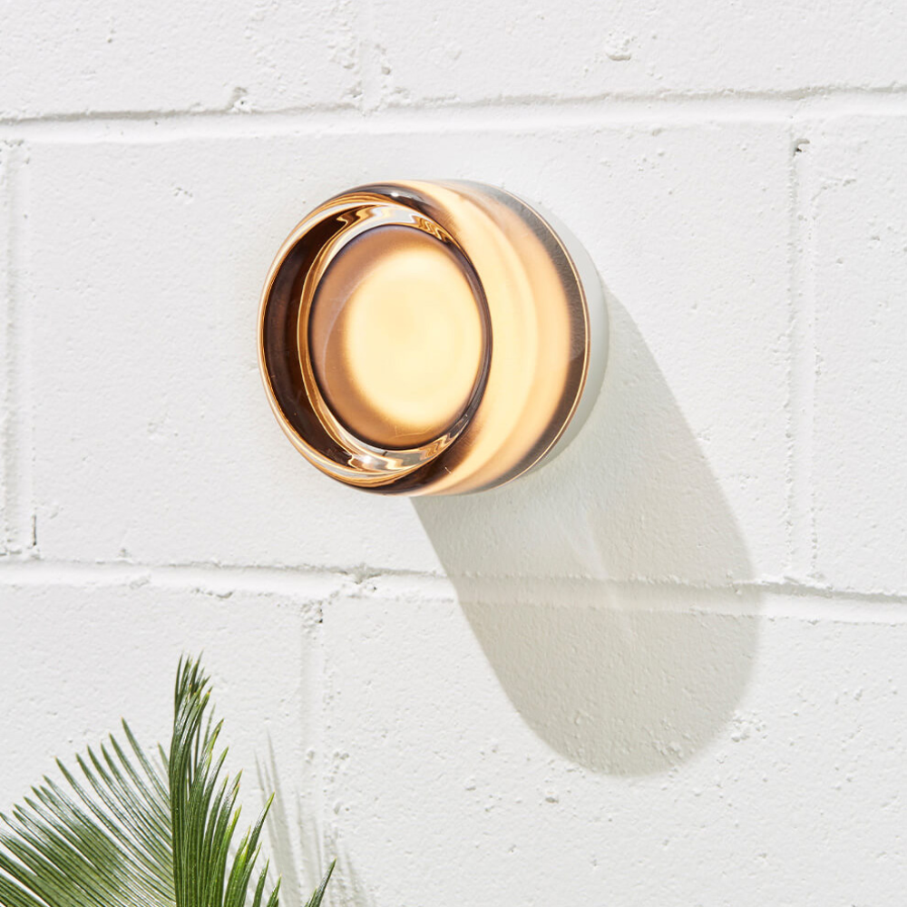 The Dimple Sconce by RBW with Smoked Interior and Natural Anodized installed on a wall. all-groups