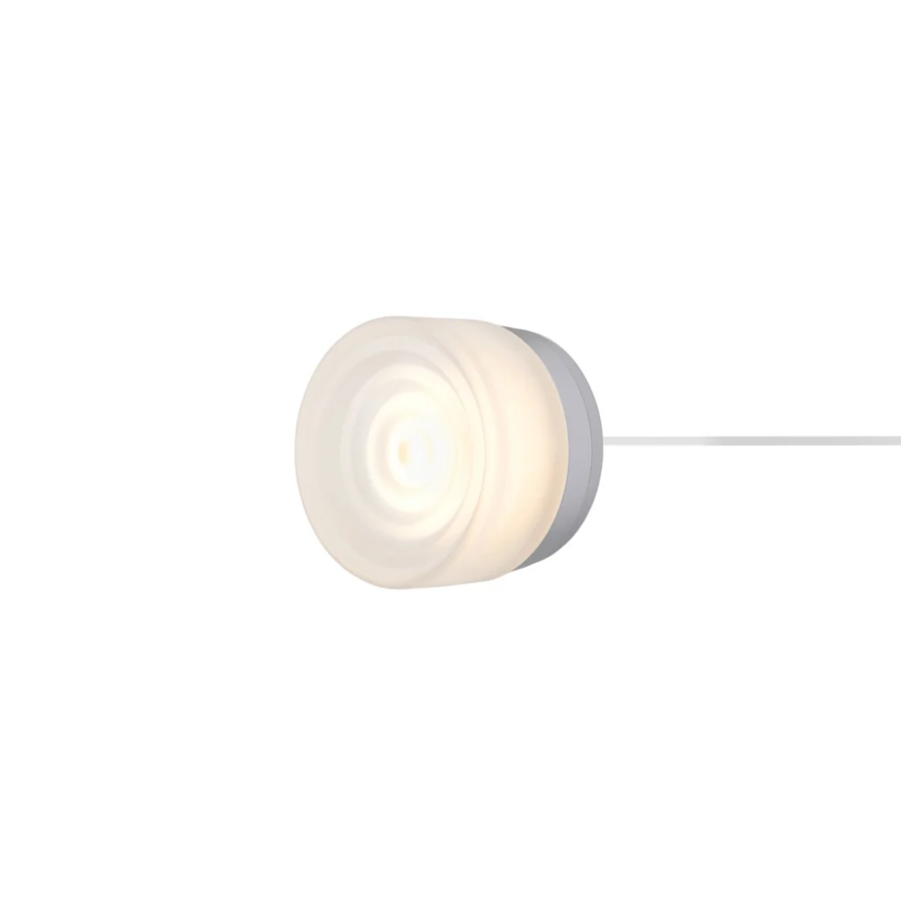 The Ripple Corded Sconce with plug-in back in frosted shade with natural anodized.