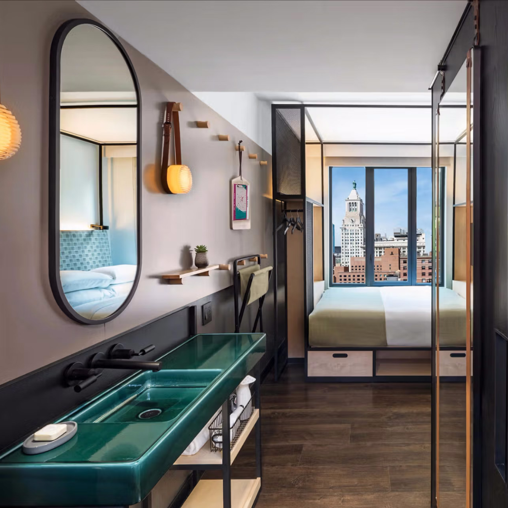 The Crisp Sconce by RBW in Copper with Black Anodized backplate in a hospitality setting. all-groups