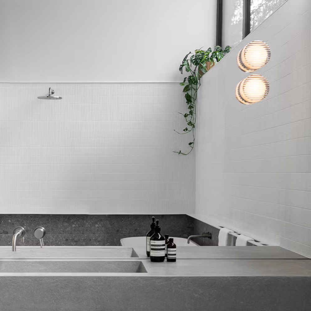 A pair of Crisp Sconces by RBW installed on a mirror. all-groups