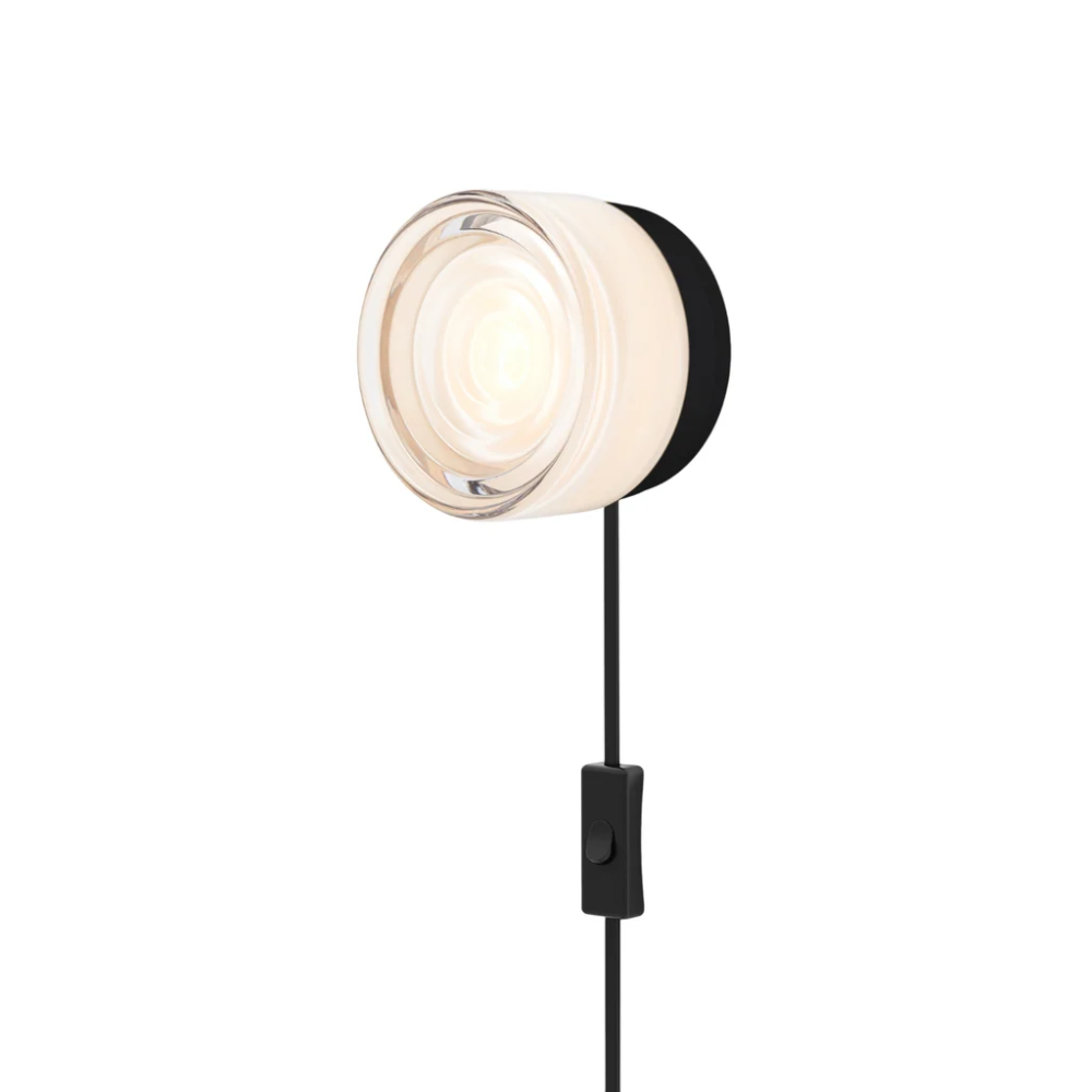 The Ripple Corded Sconce with plug-in bottom with toggle switch in white interior shade with black anodized.