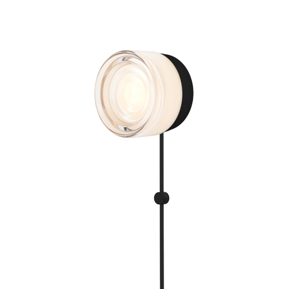 The Ripple Corded Sconce with plug-in bottom in white interior shade with black anodized.