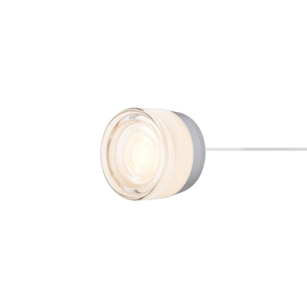 The Ripple Corded Sconce with plug-in back in white interior shade with natural anodized.