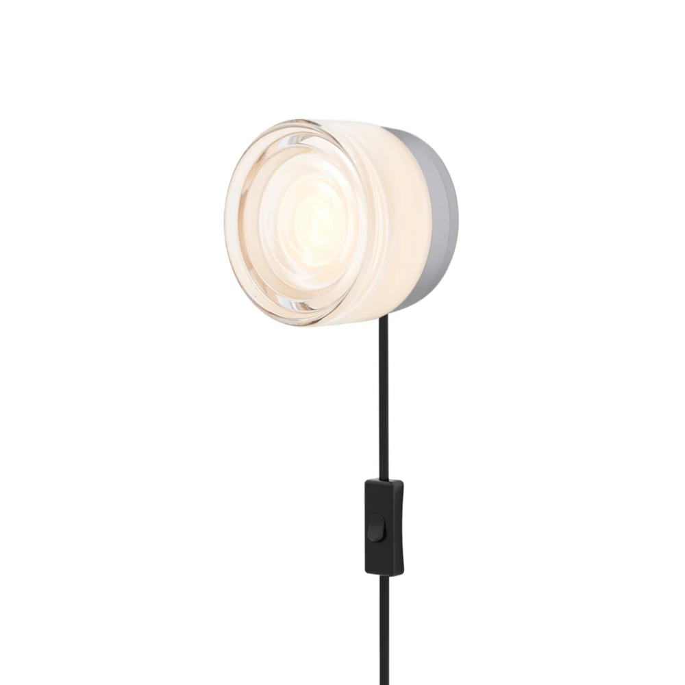 The Ripple Corded Sconce with plug-in bottom with toggle switch in white interior shade with natural anodized.