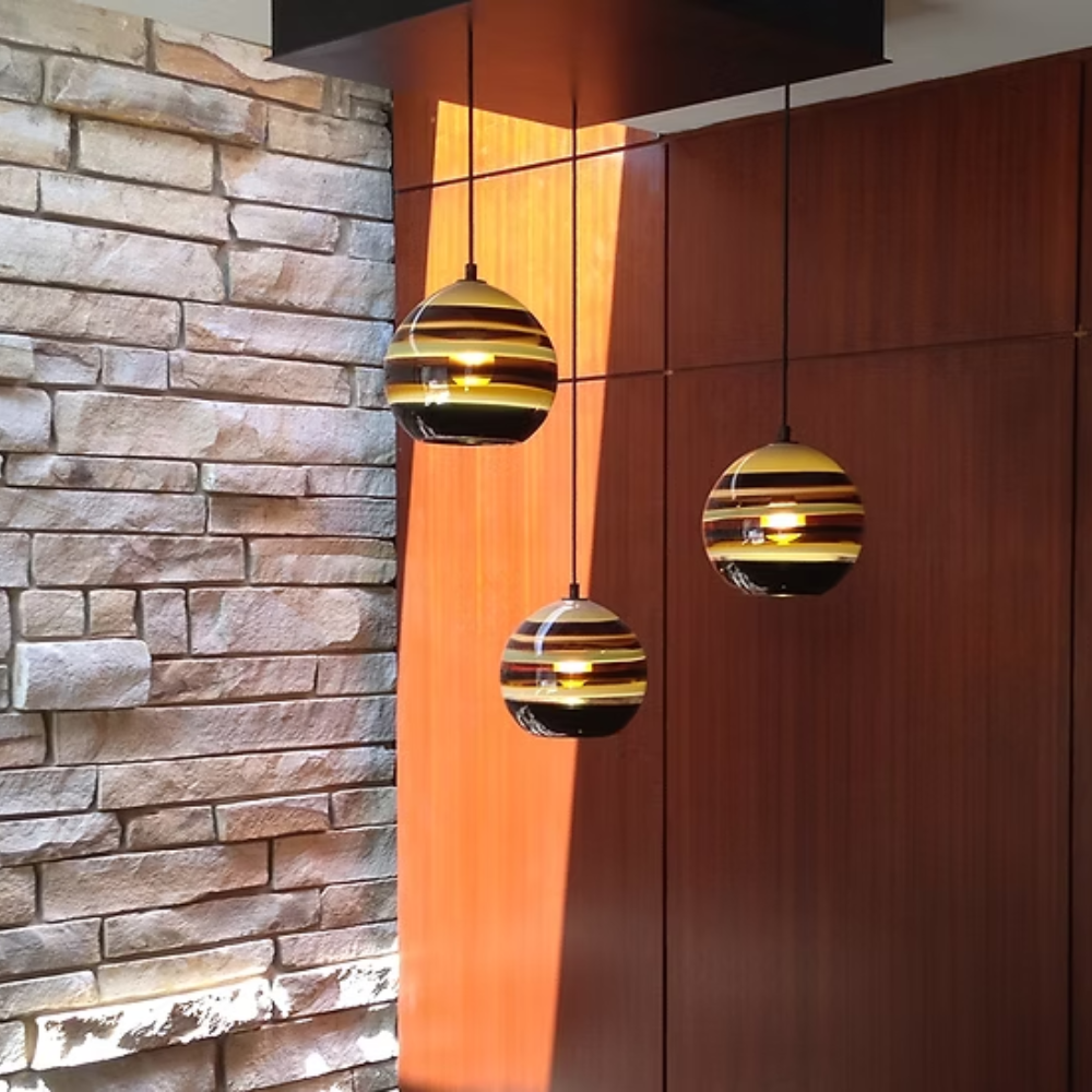 The Banded Amber Mini Pendant from Siemon and Salazar in a living room.
