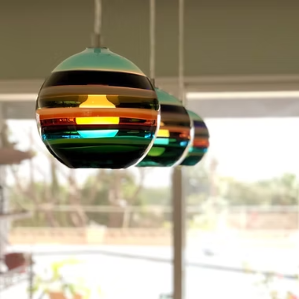 The Banded Aqua Mini Pendant from Siemon and Salazar in an office.