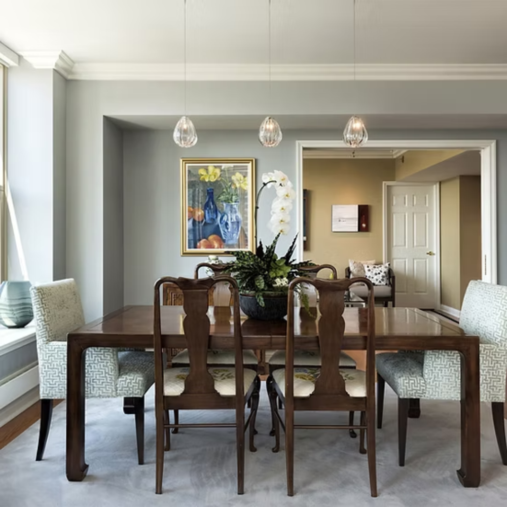 The Barnacle Small Cone Clear Pendant from Siemon and Salazar in a dining room.