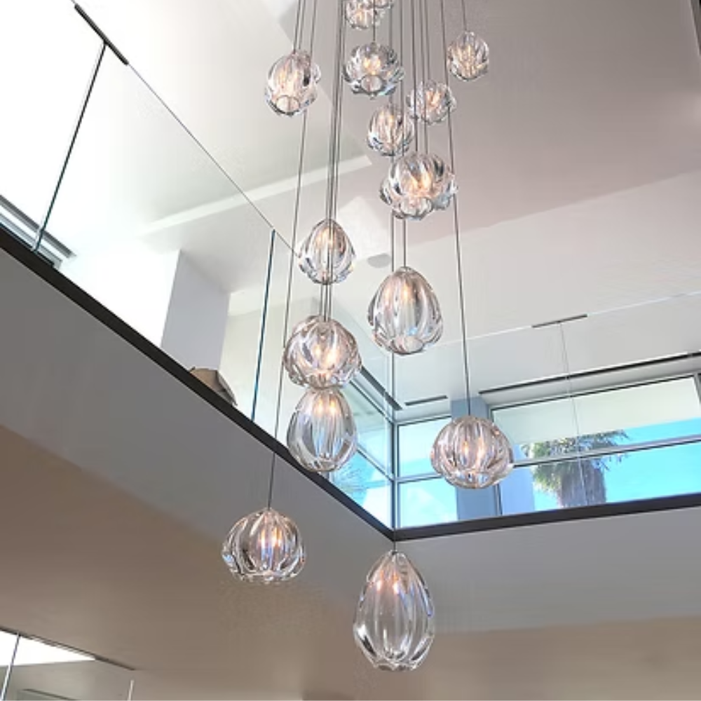 The Barnacle Small Cone Clear Pendant from Siemon and Salazar in a living room.
