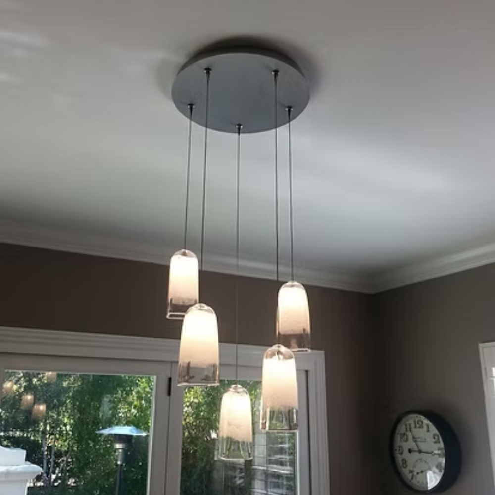 The Bubble Small Square Clear Pendant from Siemon & Salazar in a living room.
