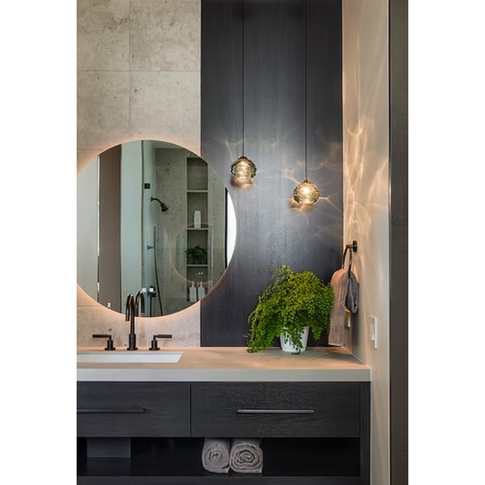 The steel grey Happy Small Pendant from Siemon and Salazar in a powder room.