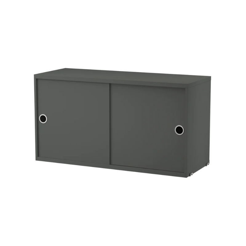 The Cabinet with Sliding Doors from String Furniture in dark grey.