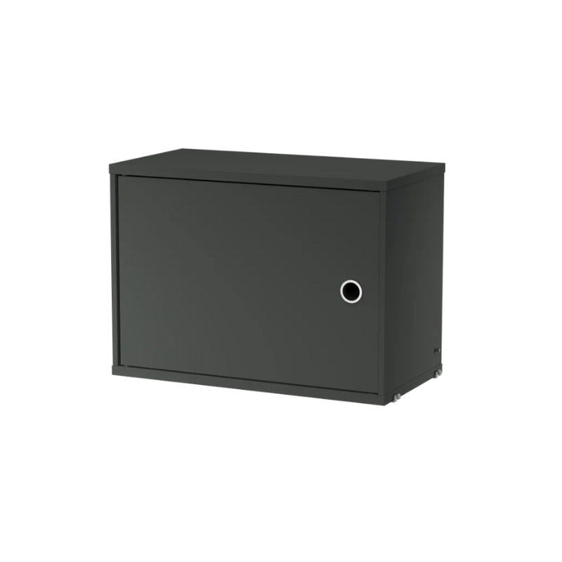 The Cabinet with Swing Door from String Furniture in dark grey.