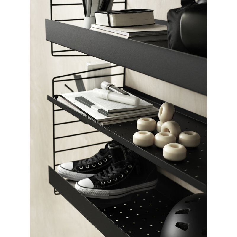 The High Metal Shelf from String Furniture in black in an entryway.