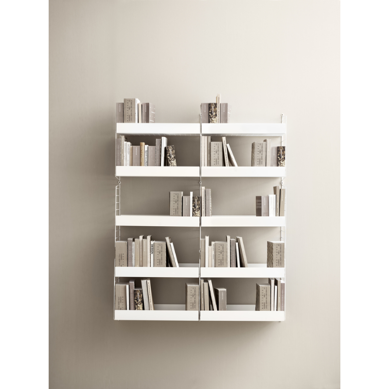 The High Metal Shelf from String Furniture used as a bookshelf.