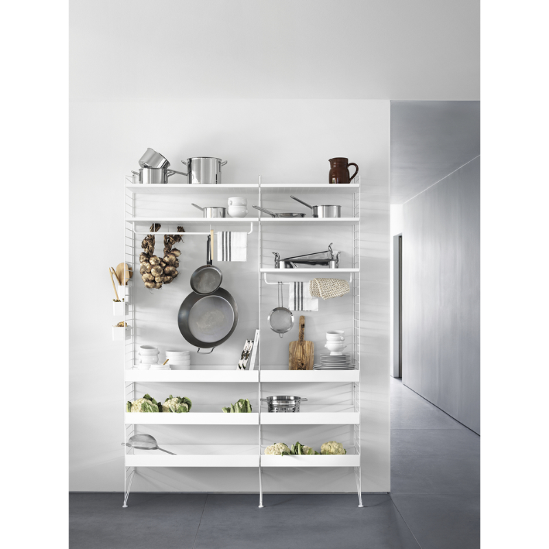 The Low Metal Shelf from String Furniture in a kitchen and dining lifestyle photograph.