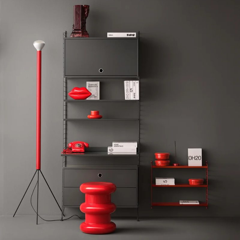 The Metal String Pocket from String Furniture in oxtorgsrod in a primary bedroom.