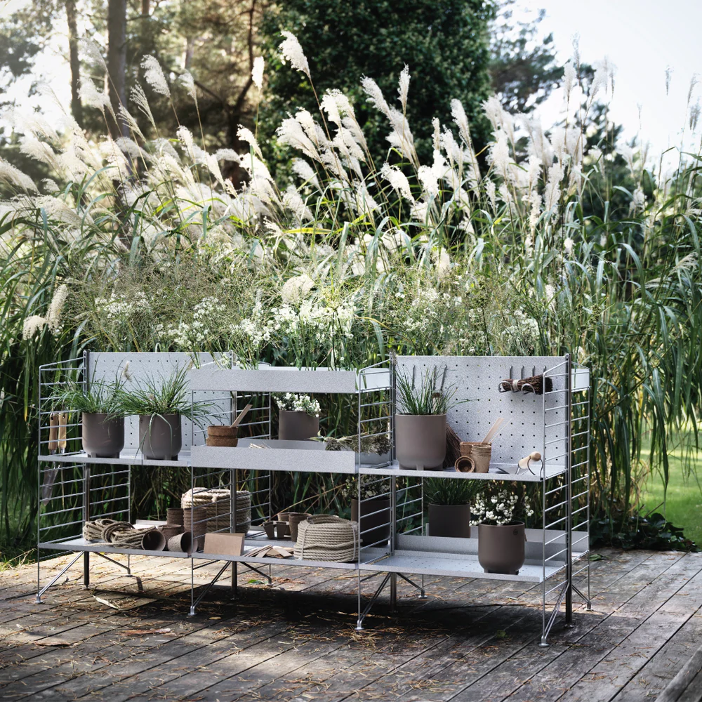 The String Outdoor Bundle from String Furniture on a patio.